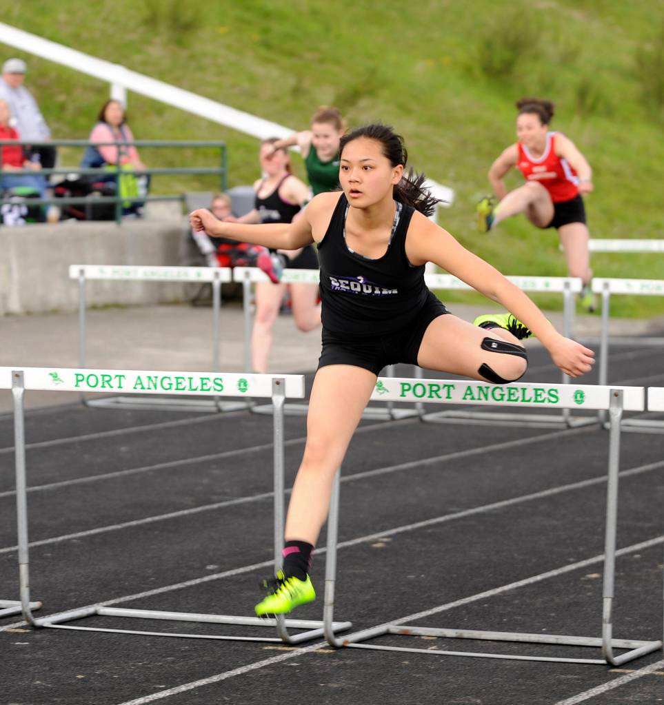 Track & Field: Sequim boys reign in the rain