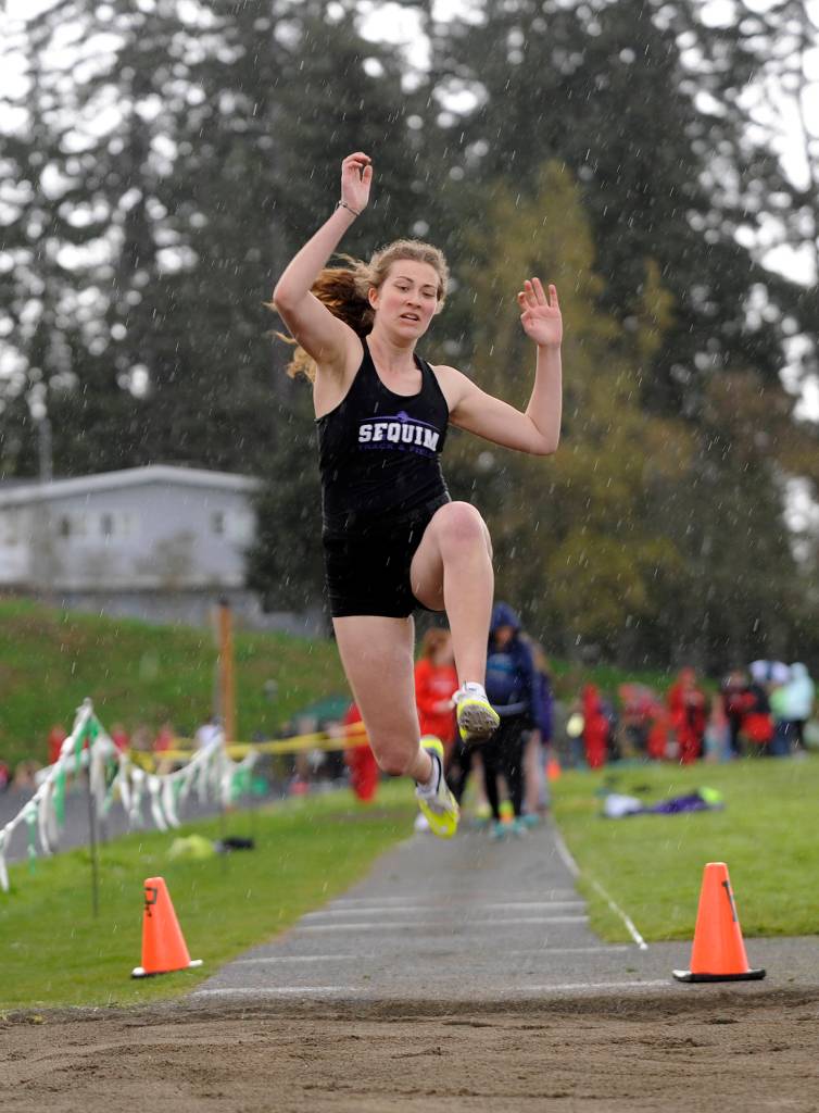 Track & Field: Sequim boys reign in the rain