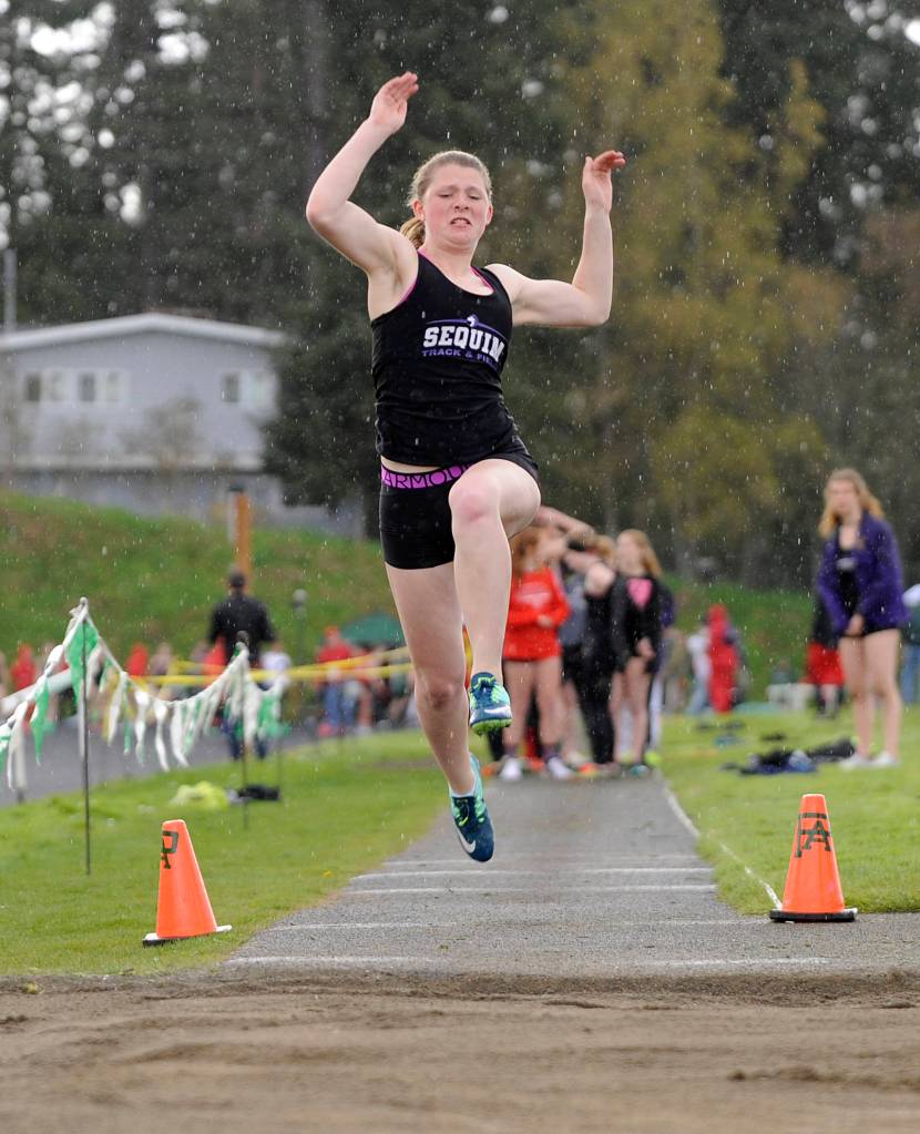 Track & Field: Sequim boys reign in the rain