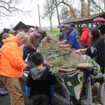 Tribal members prepare a canoe before it&rsquo;s removed from Pioneer Memorial Park in Sequim on April 8. Sequim Gazette photo by Michael Dashiell