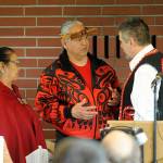 Viola Penn Riebe and Vince Penn, center, talk with Kurt Grinnell of the Jamestown S&rsquo;Klallam Tribe. Sequim Gazette photo by Michael Dashiell