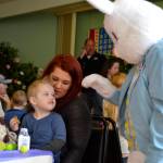 Owen Pickens, 2, and mom Jess Bell greet the Easter Bunny at the Sequim Elks Lodge&rsquo;s egg hunt event on April 15.