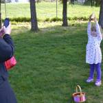 Lily Sickels, 4, of Bellingham, holds up a golden egg for her mom Pam Brock she found at the Sequim Elks Lodge&rsquo;s egg hunt on April 15. The mother-and-daughter were visiting family in Sequim for Easter weekend.