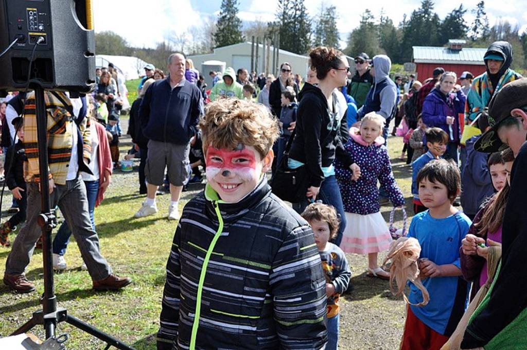 TJ Rooke shows off his fresh coat of face paint at The Pumpkin Patch Great Easter Egg Extravaganza. The Sequim High School Girls&rsquo; Swim Team Booster Club had a fundraiser for a swim timing system at the Sequim YMCA. Photo courtesy of KSQM Radio