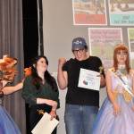 Emma Gallaher and Luke Silliman celebrate winning the audience choice award, or the Elkie, at the Student Film Festival on April 21, in Sequim High School. The friends&rsquo; film &ldquo;Welcome to Life&rdquo; also won first place and a $1,000 scholarship from the Sequim Education Foundation. Sequim Gazette photo by Matthew Nash