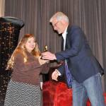 Victoria Hall accepts third place and a $500 scholarship from Sequim Schools&rsquo; Superintendent Gary Neal on April 21 for her film &ldquo;The Definition of Happiness&rdquo; at the Student Film Festival. Sequim Gazette photo by Matthew Nash