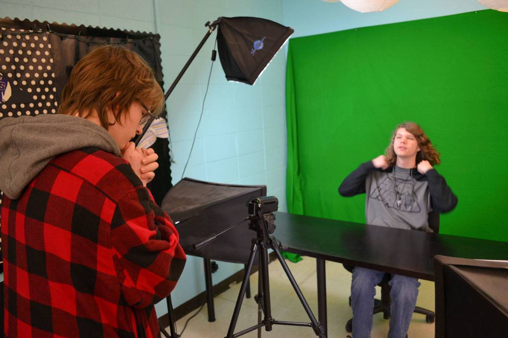 Nick Kinglsey, left, contemplates his next video segment with classmate Mathew Fowler. Both students create videos weekly for Sequim High&rsquo;s GNN, Growl News Network. Kingsley makes a top-5 list segment weekly and Fowler films a video celebrating students and staff&rsquo;s birthdays that week. Both students are in the school&rsquo;s video production class with some of the students working on films for the upcoming film festival.