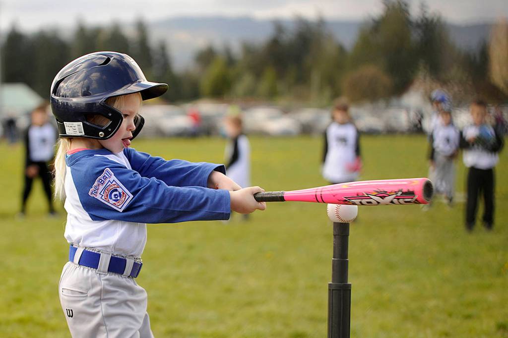 T-ball player Emily Stamon, 5, of AirFlo lines up her first hit of the 2017 season. Sequim Gazette photos by Michael Dashiell