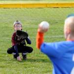 Brothers Trevor Goff, 8, (background) and Connor Goff, 9, have a game of catch after opening Sequim Little League Opening Day ceremonies. Sequim Gazette photo by Michael Dashiell