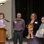 Chloe Loucks, left, stands with her family, dad Larry, mom Angela, and sister Emily, on March 8 at the Regional Outreach Luncheon Meeting for Clallam & Jefferson County at Sunland Golf & Country Club. Chloe and Larry spoke about how much Seattle Children&rsquo;s Hospital has helped her with treatment. The guilds have helped more than 1,400 patients receive 
$1.2 million in uncompensated care. Sequim Gazette photo by Matthew Nash