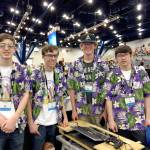Sequim robotics team members pilot Xavier Stafford, coach Riley Scott, Max Koonz and driver and team captain Riley Chase, from left, after their district&rsquo;s matches in Auburn. (Sequim High School)