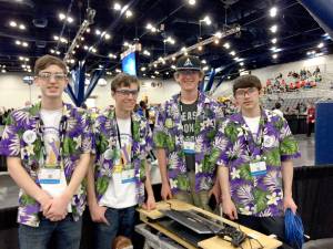Sequim robotics team members pilot Xavier Stafford, coach Riley Scott, Max Koonz and driver and team captain Riley Chase, from left, after their district&rsquo;s matches in Auburn. (Sequim High School)