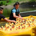 Volunteers line up Very Important Ducks for their race before the main event during the 28th annual Great Olympic Peninsula Duck Derby in Port Angeles on Sunday. (Jesse Major/Peninsula Daily News)