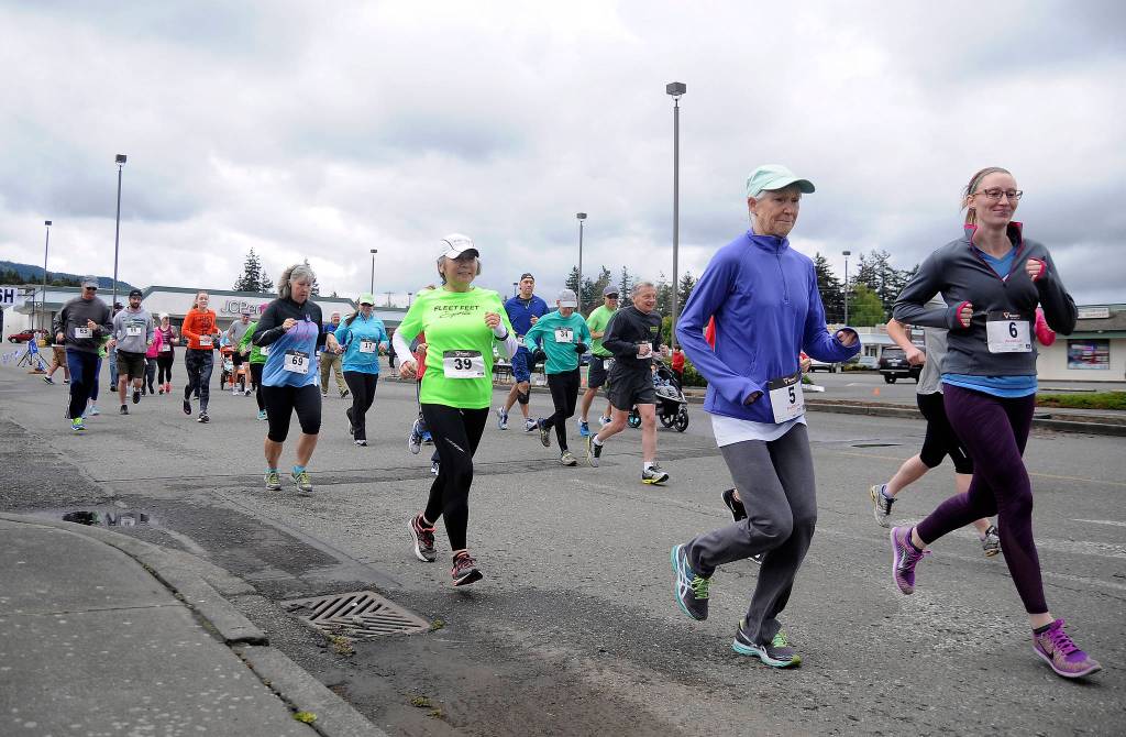 More than 70 participants break from the starting line at Saturday&rsquo;s Sequim Irrigation Festival Fun Run 5k. Sequim Gazette photo by Michael Dashiell
