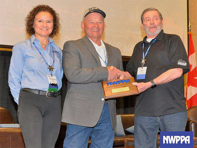 Clallam PUD&rsquo;s line foreman Sam Parks, now retired, was honored recently by the Northwest Public Power Association with the Safety Heroism Award for his lifesaving actions. Parks accepts the 2017 Safety Heroism Award from 2017 E&O Chair Catherine Simonsen and 2017 E&O Safety Committee Chair Dale Benner. On Aug. 29, 2016, Parks was driving behind another PUD employee who went into cardiac arrest and lost control of his vehicle. Parks performed CPR on his co-worker immediately, saving his life. He and co-workers had just gone through the annual CPR/AED training as required by the district three weeks earlier. The employee survived and said that he owes his life to his co-worker. Parks is the second PUD employee to receive recognition this year for heroic efforts. Joe Helvey, PUD lineman, received the Good Samaritan Award from the Washington PUD Association in December 2016. Photo courtesy of NWPPA