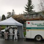 Representatives with the Clallam County Sheriff&rsquo;s Office and Coroner&rsquo;s Office investigate a homicide on the 100 block of Hurricane Drive in Sunland on Thursday, May 4. Sequim Gazette photo by Matthew Nash