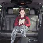 Madison White, 11, awaits a ride in a limousine to a free lunch that she won by designing this year&rsquo;s Sequim Irrigation Festival button. Sequim Gazette photo by Matthew Nash