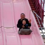 Grandma and grandson Juanita Taylor and Isaiah Loza, 3 1/2, of Sequim, enjoy a quick ride down the Super Slide at the Sequim Irrigation Festival&rsquo;s carnival. Loza said it was their first time down the slide and it was exciting. Sequim Gazette photo by Matthew Nash