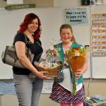 Laurel Arnau, product program manger for the Girl Scouts of the Olympic Peninsula, surprises Paige Krzyworz on May 17 in her fourth-grade classrom with news she is the highest selling Girl Scout cookie salesperson on the Olympic Peninsula and No. 2 in Western Washington. She&rsquo;ll receive a ride in a limousine with the Girls Scouts of Western Washington&rsquo;s CEO and a fancy dinner among many other goodies later this month for selling more than 3,000 boxes of cookies. Sequim Gazette photo by Matthew Nash