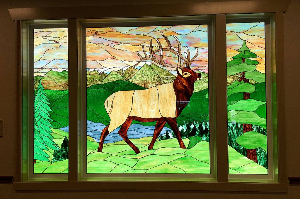 The centerpiece of the first phase remodel of the Guy Cole Convention Center is a 6-foot tall by 8-foot wide leaded glass window created by local artist Millie Harrell. Sequim Gazette photo by Matthew Nash