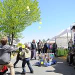 Members of the Sequim High School robotics team show off their &lsquo;bot&rsquo;s ability to project into the air plastic balls at the Family Fun Day Saturday in downtown Sequim. Sequim Gazette photo by Michael Dashiell
