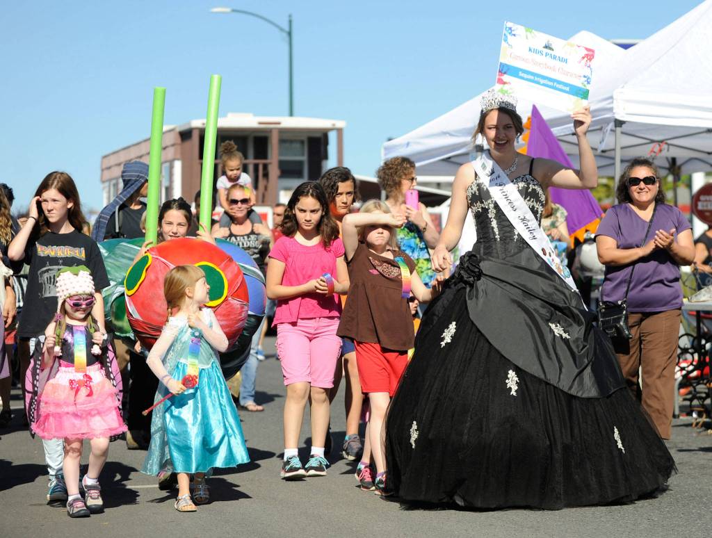 At left, Sophia Heistand of Discovery Bay finishes off 100 turns of the jump rope at last year&rsquo;s Family Fun Day as Kerry Wyamn-Webb looks on. The Fun Day returns on Saturday, May 6, starting with the Kids Parade at 9 a.m. At right,Last year&rsquo;s Irrigation festival princess Hailey Kapetan helps lead the Kids Parade in 2016. The parade is part of the festival&rsquo;s Crazy Callen Weekend, which features an arts and crafts fair, the operetta, and more. Sequim Gazette file photos by Michael Dashiell