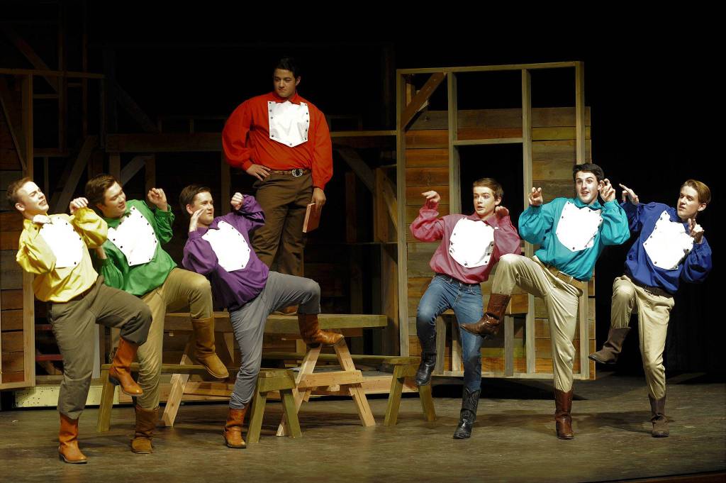 Brothers, from left, Caleb (Joe Benjamin), Frank (Tommy Hall), Daniel (Seth Mitchell), Adam (Silas Baird), Gideon (Joey Oliver), Ephraim (Thomas Hughes) and Benjamin (Christopher Heintz) have a man-to-man-to-man talk in &ldquo;Seven Brides for Seven Brothers.&rdquo; Sequim Gazette photo by Matthew Nash
