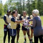 Kelly Griffin, captain of the USA Women&rsquo;s Rugby team, presents Barb Hanna — Communications and Marketing Director at City of Sequim — with a signed jersey and team rugby ball during a practice at the Albert Haller Playfields on May 25. Sequim Gazette photo by Michael Dashiell