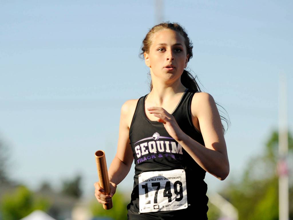 Sequim&rsquo;s Kristinna Barnet and the Wolves vie for a finals-qualifying time in the 4x400 relay at the state 2A track meet on May 25.