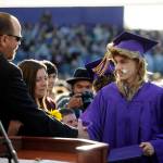 Curtis Beery accepts his high school diploma from Sequim School Board president Heather Short and vice president Brian Kuh at the Sequim High School graduation on June 9. Sequim Gazette photo by Michael Dashiell