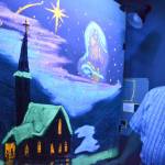 Pastor Lonnie Jacobson for Faith Baptist Church Sequim retired on June 1 after 20 years of ministry at the church. One of his traditions was drawing a chalk image during a Christmas service and revealing a surprise image with black lights, as seen here in 2011. Sequim Gazette file photo by Matthew Nash