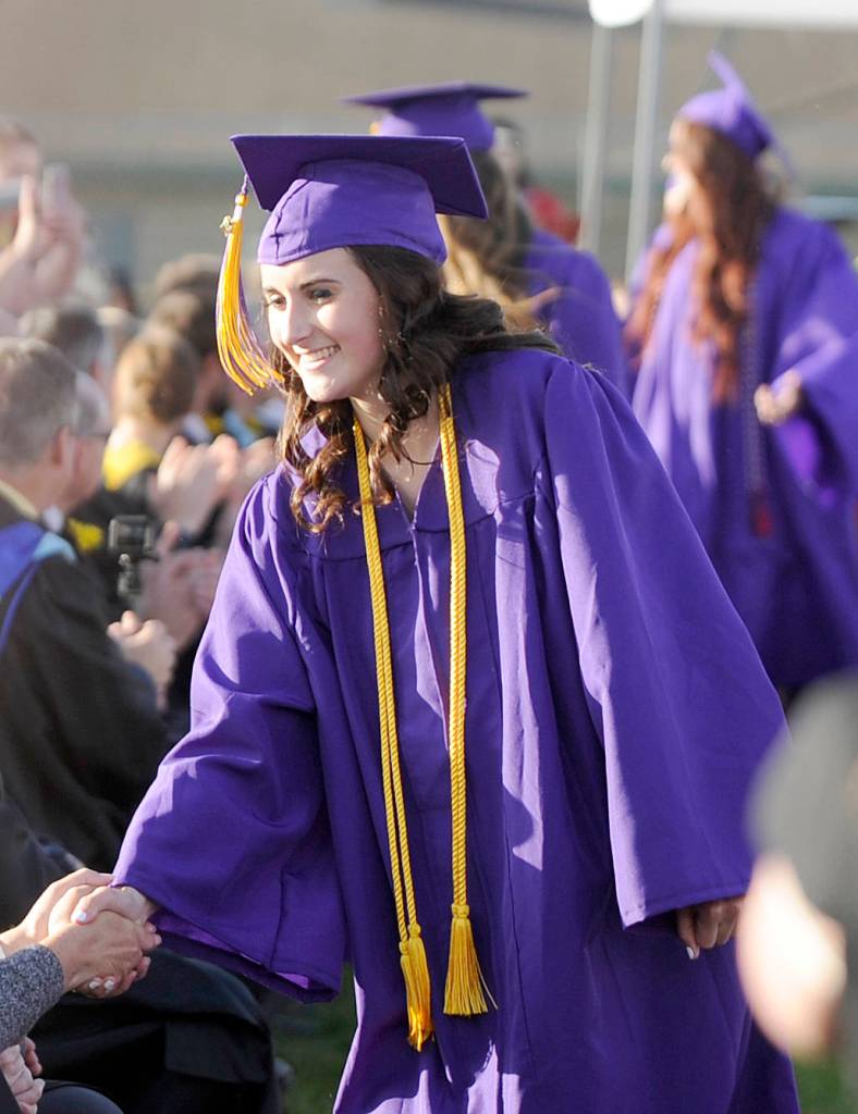 Sydney Balkan gets thanks from Sequim High staffers Friday night at Sequim High School&rsquo;s Class of 2017 commencement ceremony. Sequim Gazette photo by Michael Dashiell