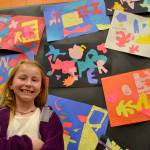 Piper Thurston, 8, of Renee Mullikin&rsquo;s class, stands with her art piece that follows the style of Henri Matisse. She liked this one of her best because &ldquo;you can make up your own art and have fun.&rdquo; Sequim Gazette photos by Matthew Nash