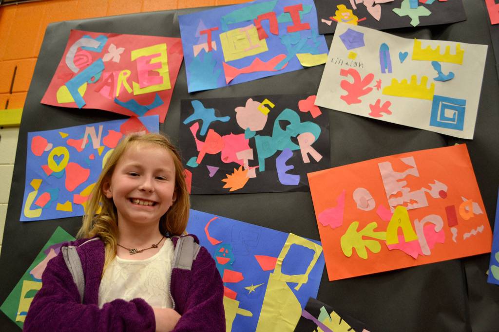 Piper Thurston, 8, of Renee Mullikin&rsquo;s class, stands with her art piece that follows the style of Henri Matisse. She liked this one of her best because &ldquo;you can make up your own art and have fun.&rdquo; Sequim Gazette photos by Matthew Nash