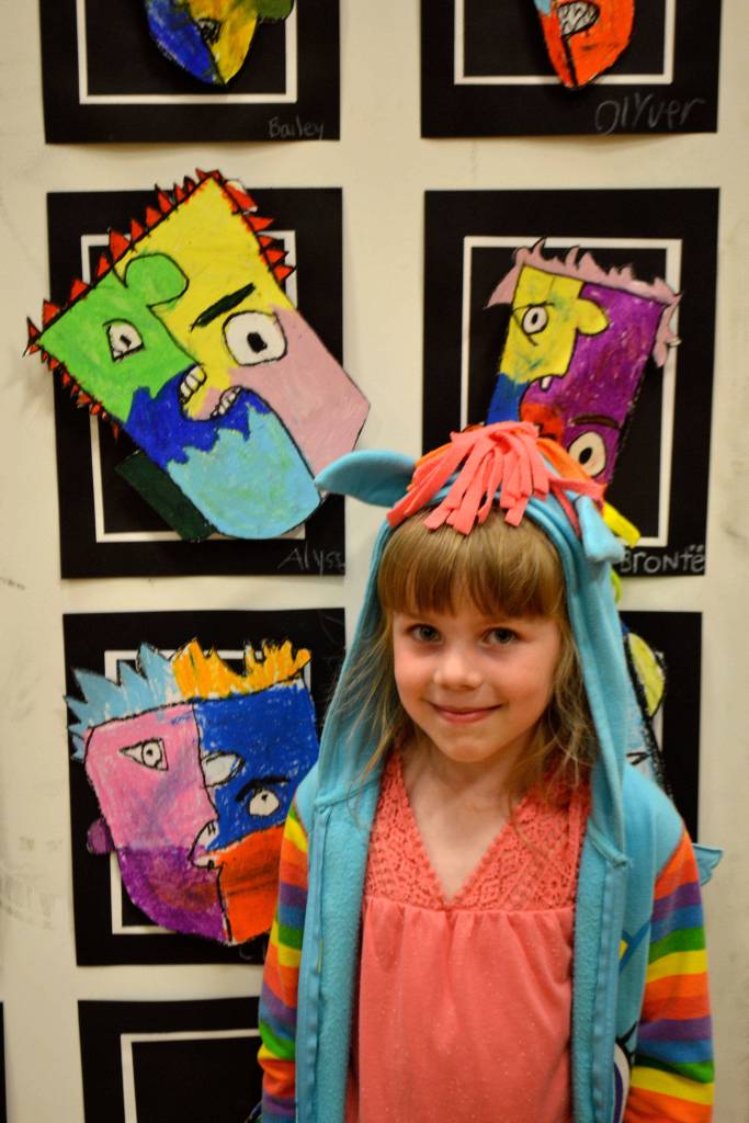 Alyssa L&rsquo;Ami, kindergartener in Stephanie Grotzke-Nash&rsquo;s class, poses with her piece of art following Pablo Picasso&rsquo;s style.