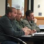 Chris Anderson, left, owner of CA Homes, testifies at a hearing with his staff for his proposed 73-unit manufactured home project in Carlsborg on June 1 in the Clallam County Courthouse. Anderson said he would comply with the additional studies Hearing Examiner Andrew Reeves gave him including a critical areas report and lighting plan.