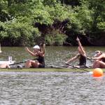 Varsity eight teammates for the University of Washington, including Elise Beuke, third from left, celebrate after crossing the finish line to earn a first-place finish on May 28. Photo courtesy of University of Washington.