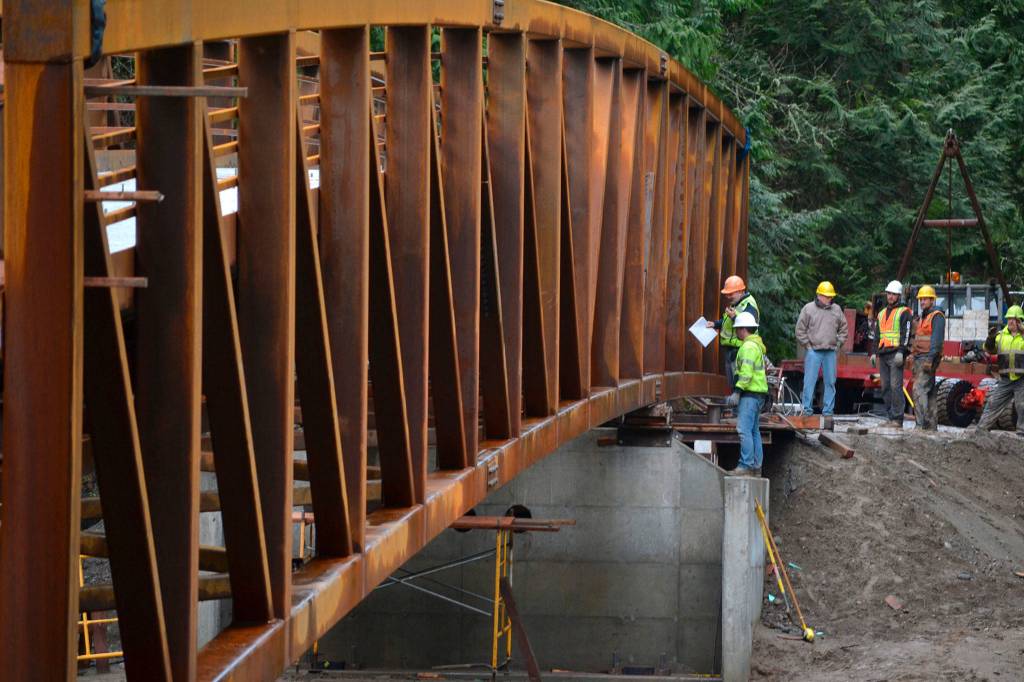 In January, crews work to place the Sequim Bay Bridge in Sequim Bay State Park. The bridge was completed in May and opened to connect the Olympic Discovery Trail. Sequim Gazette file photo by Matthew Nash