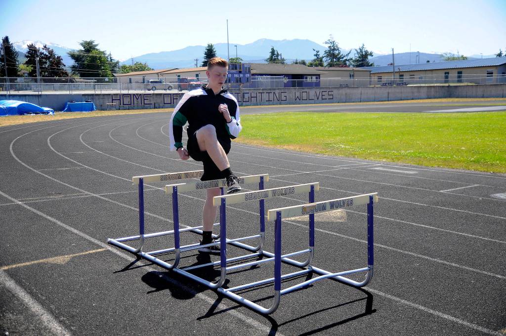 By leaps and bounds: Sequim teen Logan Laxson sees track work pay off at Junior Olympics