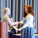 Sequim High School senior Stephanie Grow, right, accepts her U.S. Navy Post 911 Educational Benefit scholarship (worth $110,000) from Petty Officer Wendy Schwandt. Sequim Gazette photo by Michael Dashiell