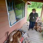 Barb McFall, Clallam County&rsquo;s only code enforcement officer, looks over a vacant home. (Jesse Major/Peninsula Daily News)