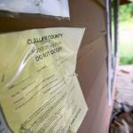 A &ldquo;do not occupy&rdquo; notice hangs on the wall of a vacant home. (Jesse Major/Peninsula Daily News)
