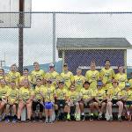 Participants and volunteers/coaches at the Sequim Tennis Academy take a break from activities at the Sequim High School courts last week. Sequim Gazette photo by Michael Dashiell