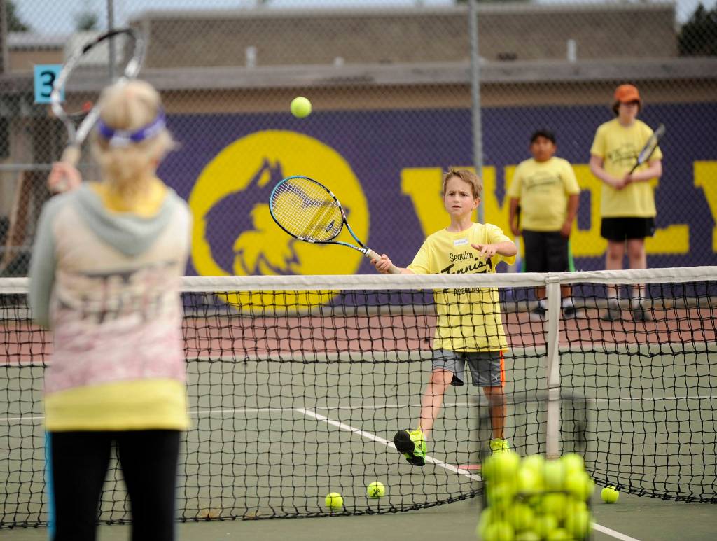 9-year-old Joshua Alcaraz returns a shot. Sequim Gazette photo by Michael Dashiell