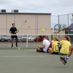 Blake Wiker (background) awaits a return volley in a game with experienced Tennis Academy campers. Sequim Gazette photo by Michael Dashiell