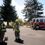 Firefighters from Clallam County District 3 respond to an attic fire in Carlsborg on July 18. No injuries were reported in the incident. Sequim Gazette photo by Michael Dashiell