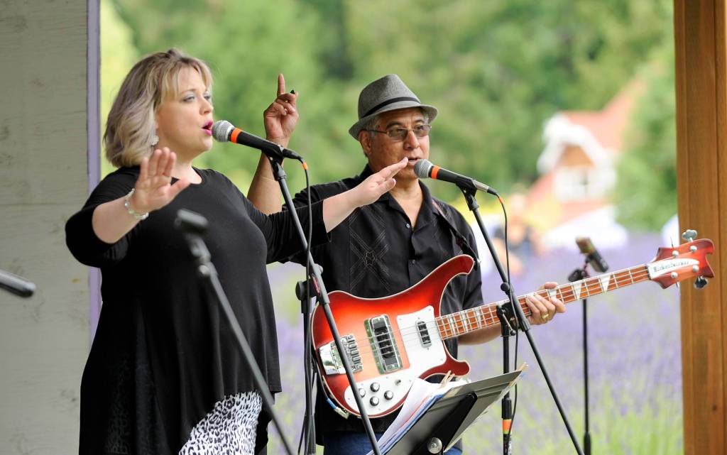 Amanda Bacon and Erik Richardson of Black Diamond Junction bring a variety of musical styles and eras to the crowd at Purple Haze Organic Lavender Farm on Friday, July 21. Sequim Gazette photo by Michael Dashiell
