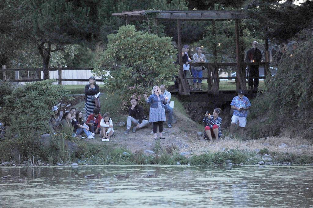Amanda Bacon sings Leonard Cohen&rsquo;s &ldquo;Hallelujah&rdquo; at a vigil and tribute at Carrie Blake Community Park&rsquo;s Friendship Garden on July 24. Sequim Gazette photo by Michael Dashiell