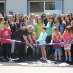 Greywolf Elementary School principal Donna Hudson helps Bianca Lopez and Benjamin Smith with the ribbon cutting at Greywolf Elementary School&rsquo;s new kindergarten classroom building on June 28. Sequim Gazette photos by Michael Dashiell