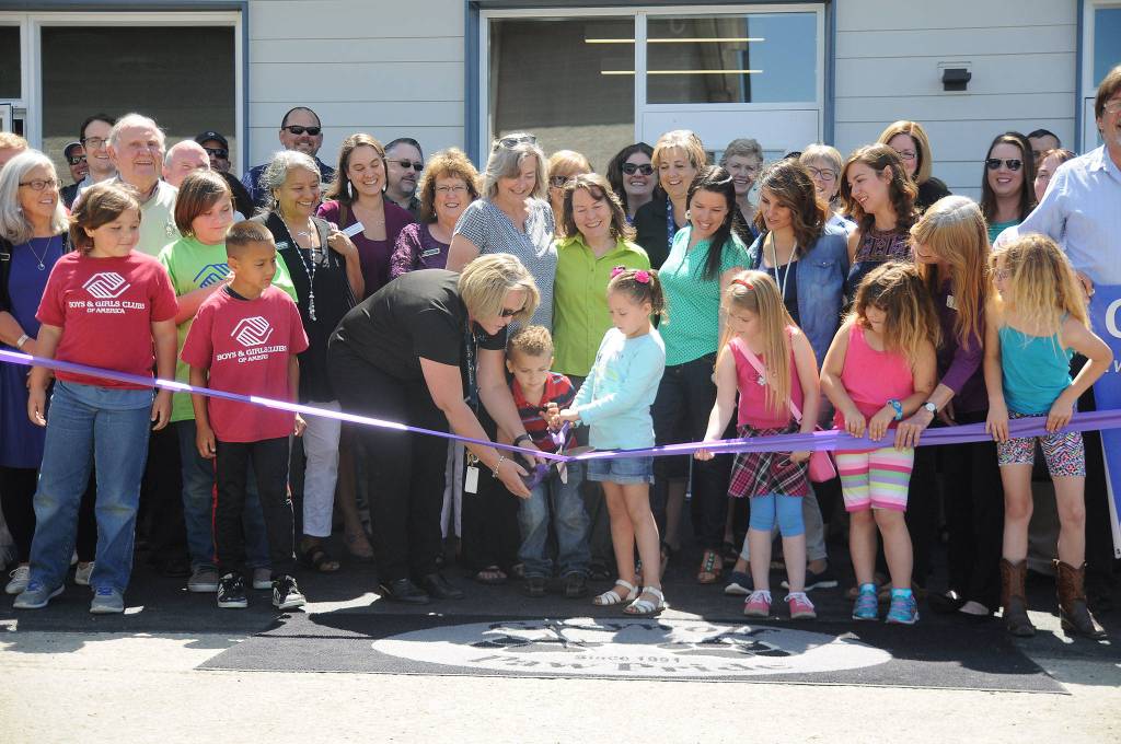 Greywolf Elementary School principal Donna Hudson helps Bianca Lopez and Benjamin Smith with the ribbon cutting at Greywolf Elementary School&rsquo;s new kindergarten classroom building on June 28. Sequim Gazette photos by Michael Dashiell